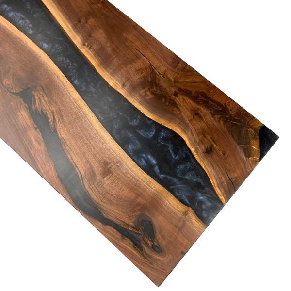 Black walnut dining room table with epoxy resin river design. Midnight blue epoxy by Eye Candy Pigments.