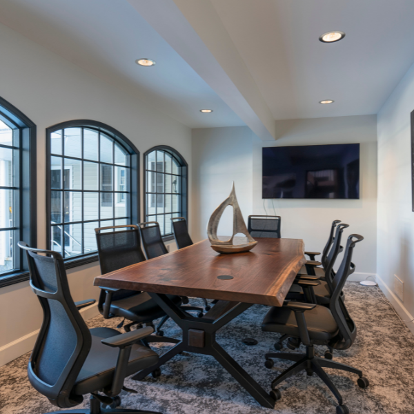 Custom conference table in black walnut with live edge detailing