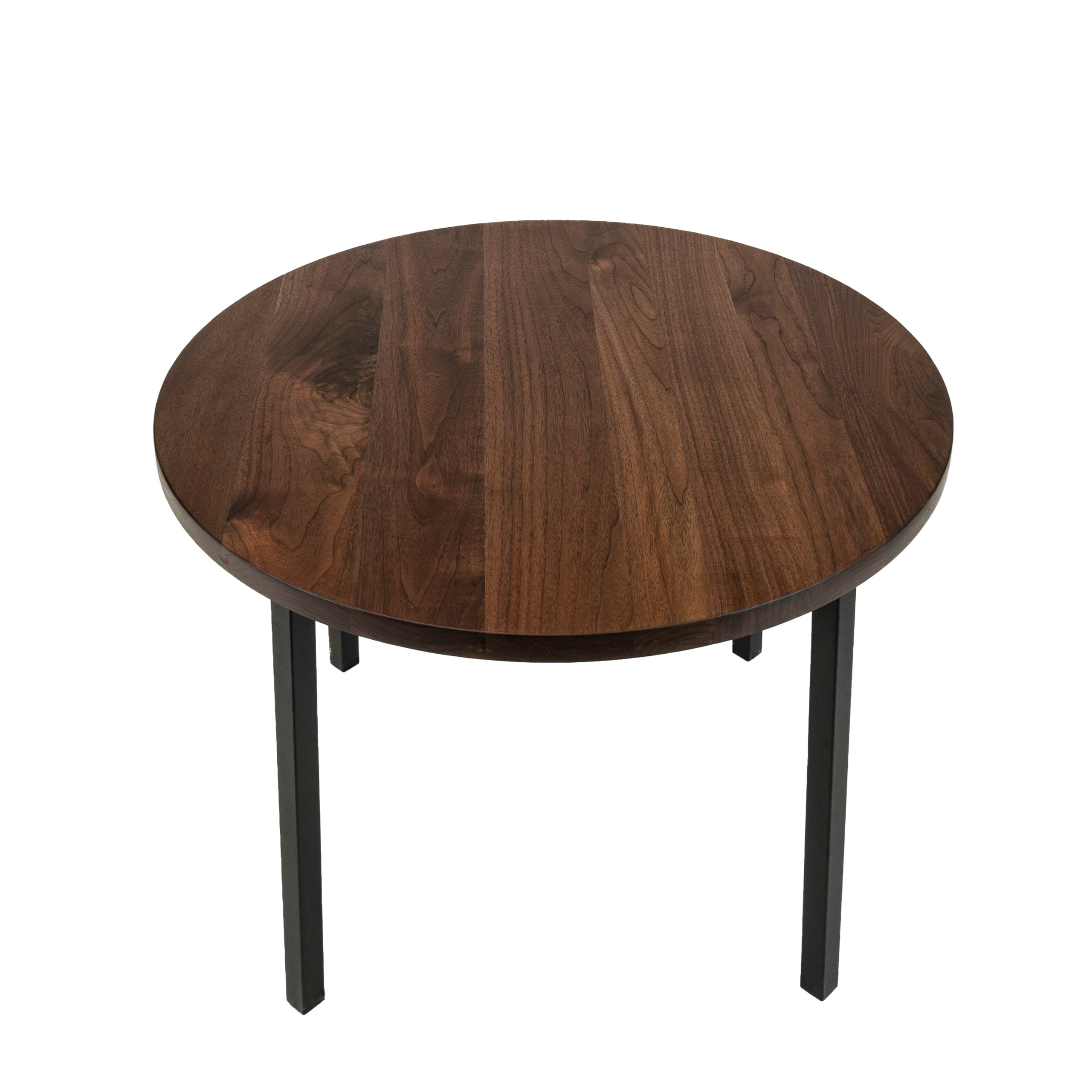 Round black walnut kitchen table. Designed by Urban Industrial Design.